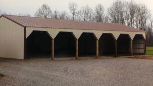 Long open-front shed with a brown roof and six timber-post bays