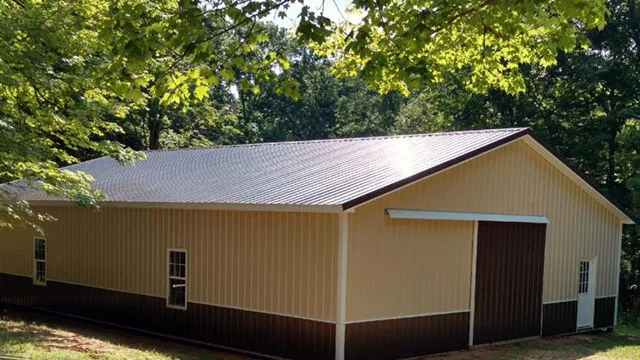 Cream building with a brown roof and wainscot and a sliding door