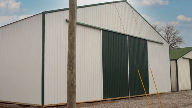 White building with green split sliding doors