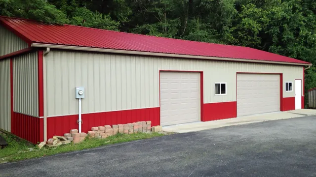 Cream building with a red roof, red wainscot and two overhead doors