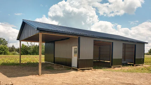 Brown building with a dark roof and a gable porch on timber posts