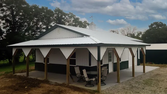 Cream building with a green roof and a wrap-around porch