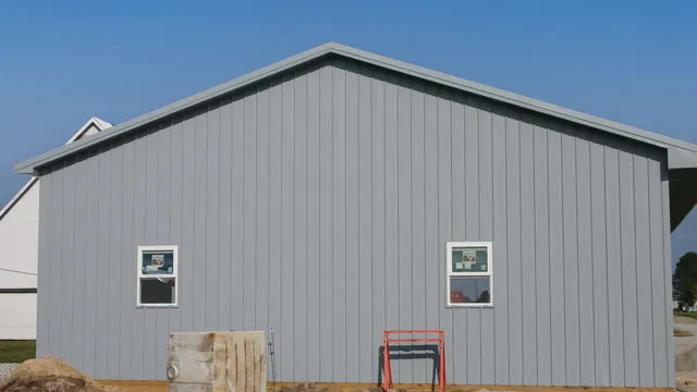 Gray shop gable end with two windows