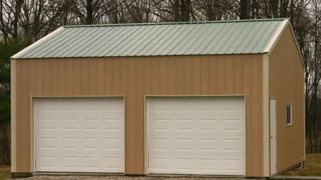 Tan garage with two white overhead doors under a green roof
