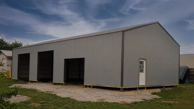 Tan building with three open bays and a white walk door on gravel