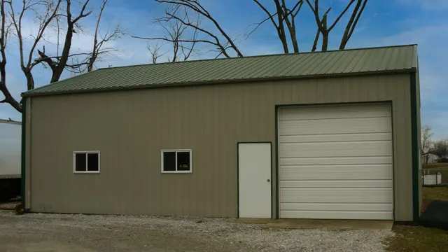 Olive green shop with two windows, a walk door and a white overhead door