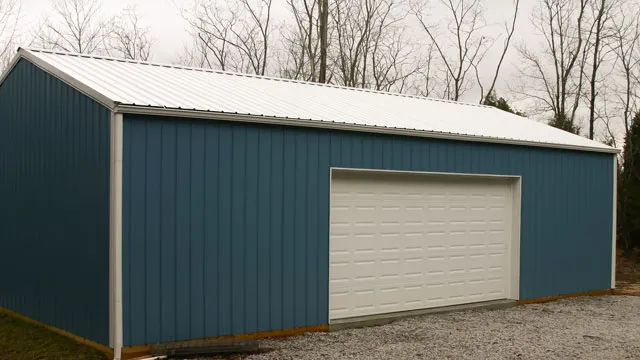 Blue building with a white roof and a white overhead door